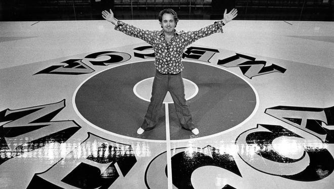 Robert Indiana, artist, poses with the Mecca floor he designed, as seen in a Journal Sentinel file photo from October 1977.