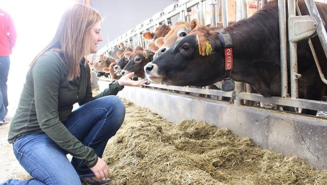 Micheala Slind gets up close and personal with a cow during a farm while attending UW-Madison. during school. 

Let me know if you were looking for anything different.