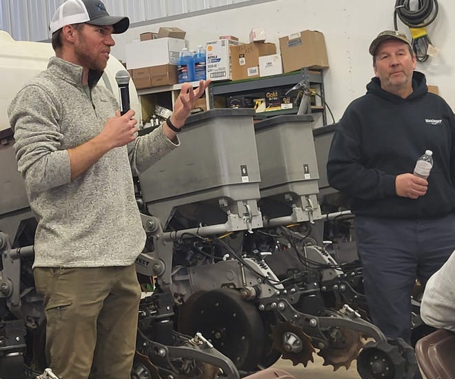 Brendon Blank, farmer and cover crop specialist, left, speaks at the spring meeting of the Dodge County Farmers for Healthy Soil & Healthy Water at Ralph Weninger's farm in Rubicon, Weninger, right, who raises 1,500 acres of cash crops, is a champion of using cover crops.