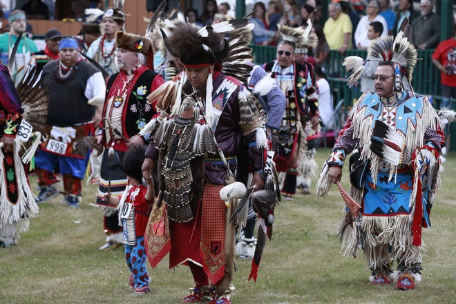 Native Americans from various tribes gather Friday, July 20, 2018, to celebrate the Honor the Earth Pow-wow event at LCO School in Hayward, Wis.