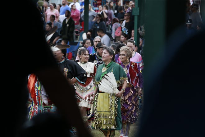 Native Americans from various tribes gather Friday, July 20, 2018, to celebrate the Honor the Earth Pow-wow event at LCO School in Hayward, Wis.