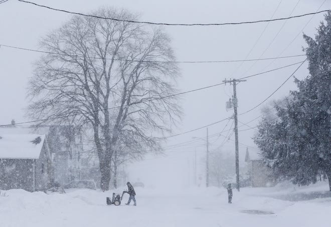 A view of the 1000 block of 13th Street as a snowstorm moves across the state Monday, Jan. 28, 2019, in Manitowoc, Wis.