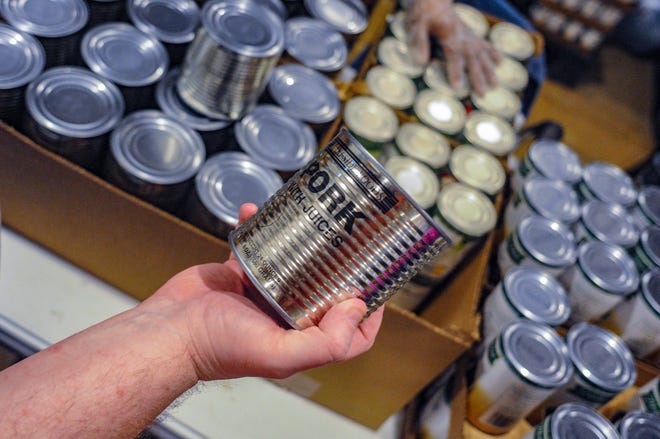 In this May 15, 2019 photo, canned meat from Lakeside Foods in Owatonna, Minn., was purchased by the USDA to offset losses from the ongoing trade wars with China, Mexico and other countries.