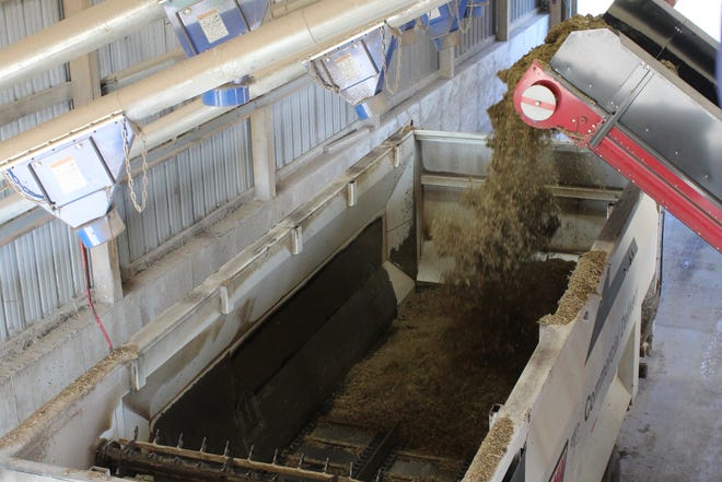 A batch of feed is loaded into a self-unloading feed truck at Vir-Clar Farms.