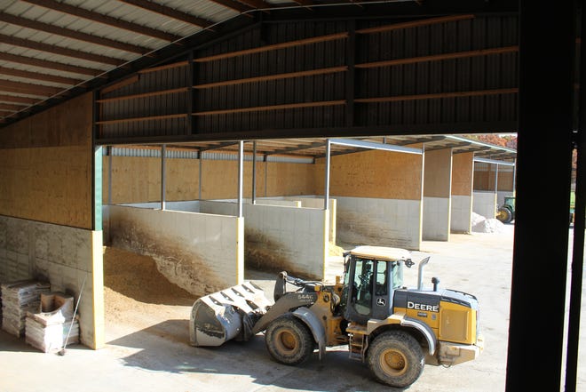 A payloader enters one of the commodity bays just outside the Feed Center at Vir-Clar Farms.
