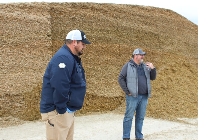 Corey, right, and Clint Hodorff talk about new the feeding set up at their Eden farm.