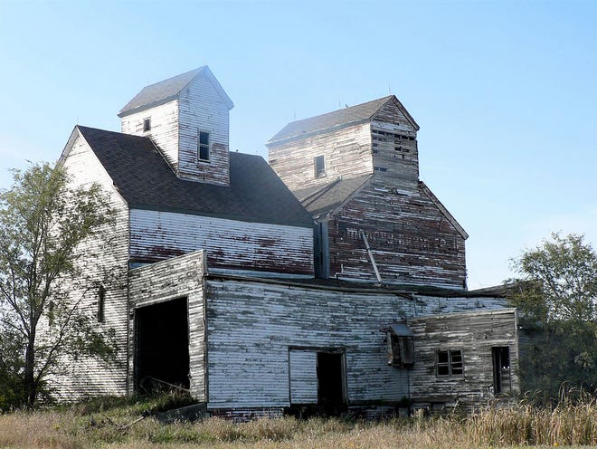 The long vacant and decaying Mondry Grain Co. at Andoch, North Dakota.