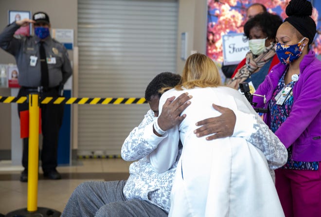 Arvin McCary hugs his doctor Sarah Nickoloff in the lobby of the Milwaukee VA Medical Center on Tuesday, May 5, 2020.