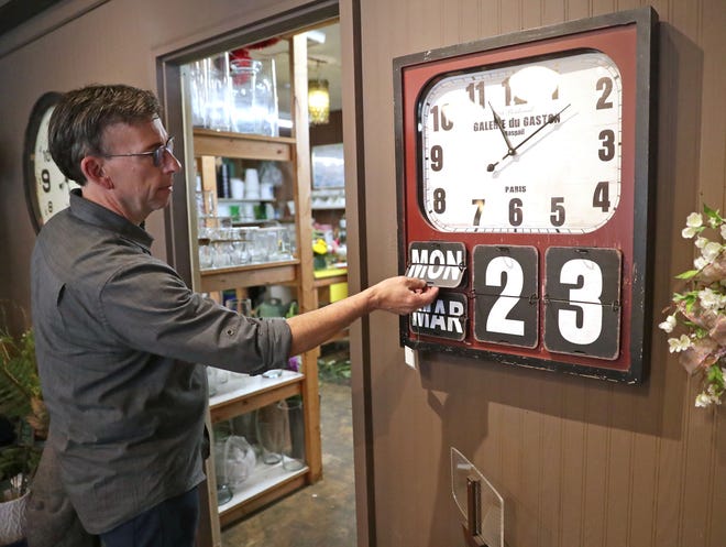 Phil Krainz, co-owner of Rose's Flower Shop, said they have not yet changed the date on their clock from the last time the flower shop in Wauwatosa was open for customers on March 23, when the "safer-at-home" order issued by the governor closed all nonessential businesses. They  reopened Tuesday, May 12, 2020.