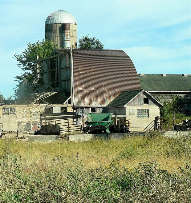 The barn fell but the silo  stands solid.